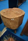 A traidtional chopping block, raised on stick legs