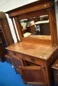 A late Victorian oak mirro back sideboard having Art Nouveau style drawer handles, dimensions