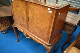 A mid 20th Century Epstein style walnut cocktail cabinet