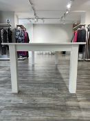 A moder shop display table, white powder coated, approx. 243 x 121cm