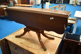 A reproduction mahogany drop leaf coffee table, width approx. 91cm