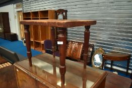 A 19th Century luggage rack on mahogany turned legs, approx 60 x 40cm