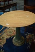 A traditional circular garden table having cast base