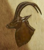 After Dennis Thomson (20th Century, South African), copper on hide, a mid-20th Century depiction