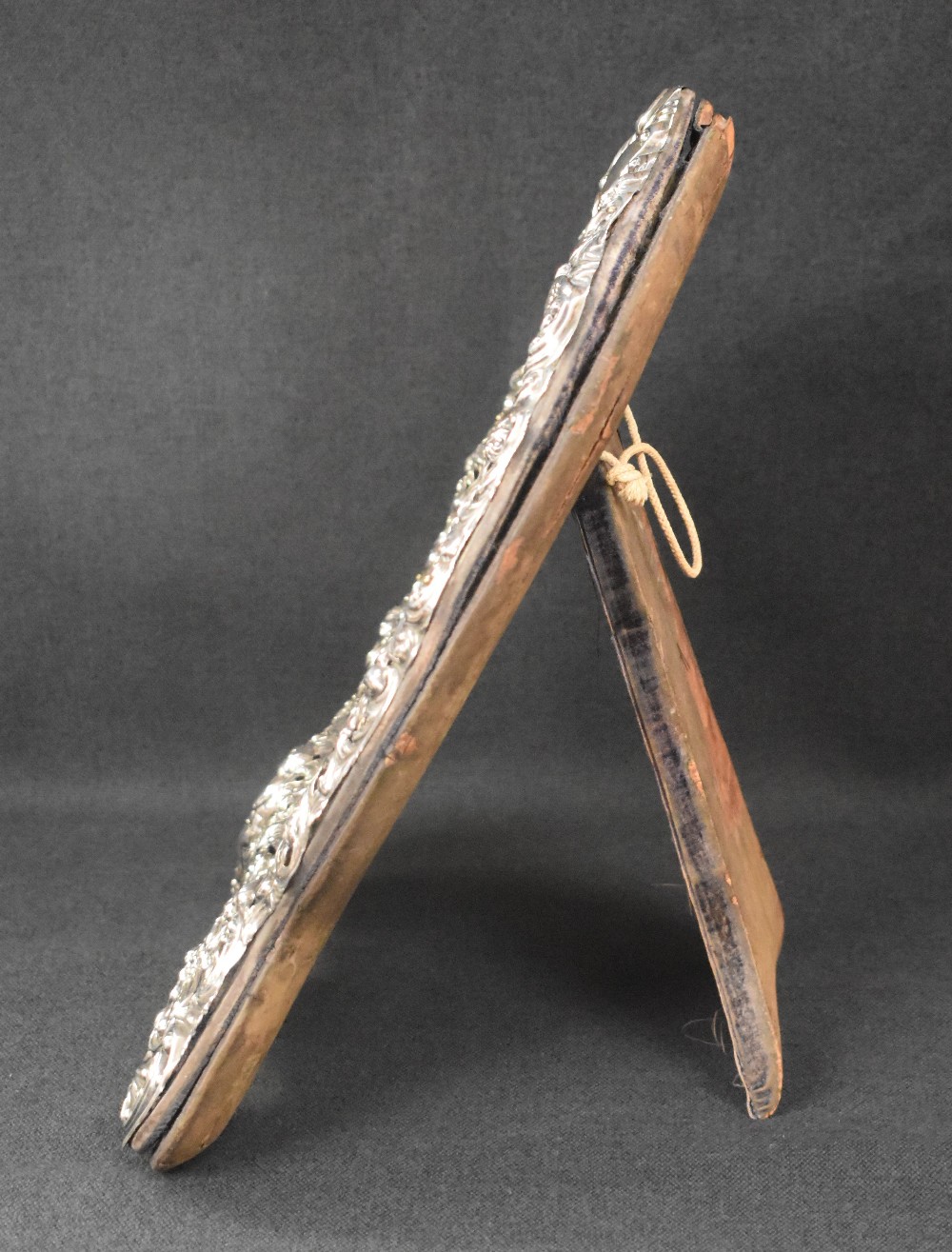 A late Victorian silver mounted heart shaped mirror, the embossed frame incorporating scroll work, - Image 3 of 4