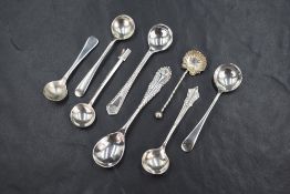 An assortment of eight silver condiment spoons, of various design including Old English, Albany