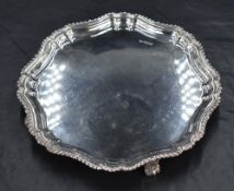 A George V silver visiting card tray, of shaped circular form of Chippendale influenced design