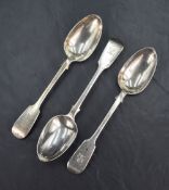 A group of three Victorian silver fiddle pattern spoons, all having a lion rampant heraldic crest to