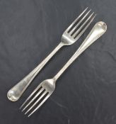 A pair of George III silver Hanoverian pattern forks, having thread decoration, marks for London