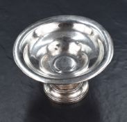 A George V silver pedestal bonbon dish, of circular flared form raised on a circular step moulded