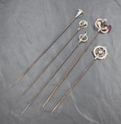A group of five Charles Horner silver hat pins of various design, sold along with the base of a