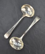 A pair of George IV silver Old English pattern sauce ladels, having 'MJ' engraved monogram to