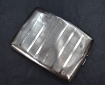 A late George V silver cigarette case of hinged rectangular form, having vertical stripes of