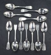 A group of eleven George IV silver fiddle pattern teaspoons, having engraved heraldic crest and '