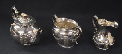 A late Victorian silver three piece tea set, of baluster form comprising tea, milk and sugar, having