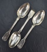A group of three early 19th century silver fiddle and thread pattern serving spoons, having engraved