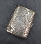 A George V silver cigarette case of hinged rectangular form, having engraved floral scroll