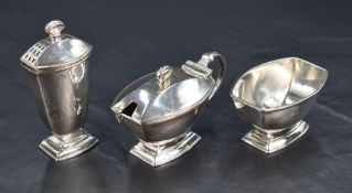 A George V silver three-piece condiment set, comprising salt, pepperette and mustard, of rounded