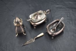 A George V silver three-piece condiment set, comprising salt, pepperette and mustard, having