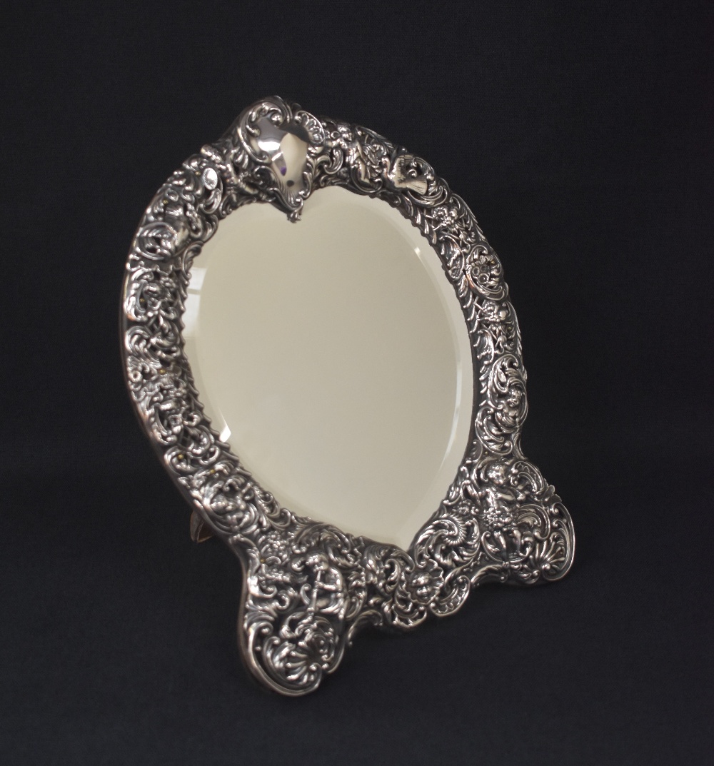 A late Victorian silver mounted heart shaped mirror, the embossed frame incorporating scroll work, - Image 2 of 4