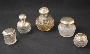 A collection of silver topped and mounted dressing table wares, including a late Edwardian cut glass