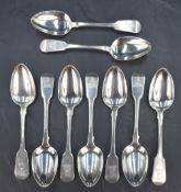A group of nine George IV silver fiddle pattern spoons, having engraved heraldic crest and 'JMM'