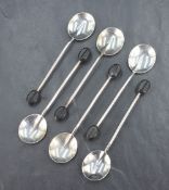 A cased set of George V silver coffee bean spoons, having a rat tail style design, marks for