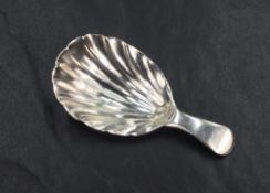 An 18th century silver caddy spoon with shell form bowl, makers mark of William Sumner and Richard