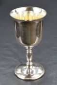 An Elizabeth II silver goblet of traditional form with gilt interior, having a flared rim and