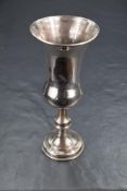 A George V silver Kiddush cup, of bulbous form with decorative engraving, having a flared rim and