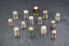 An assortment of eight silver thimbles of various size and design including Charles Horner examples,