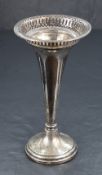 An early George V silver vase, of fluted form with decorative pierced rim with bead thread, raised