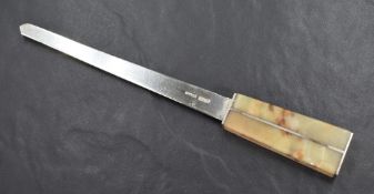 An Elizabeth II silver and green onyx letter opener, the blunt silver blade with a geometric onyx