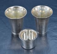 Two early 20th century Danish silver cups, of flared cylindrical form one having planished