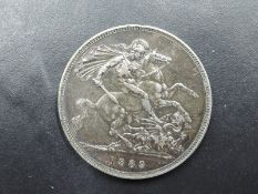A 1889 Queen Victoria Silver Crown, Jubilee Head, slight dent to edge, sharp condition