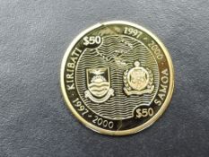 A Kiribati & Samoa Millennium Gold Proof $50 Coin in two parts, 8g of 999/1000 Gold, Westminster