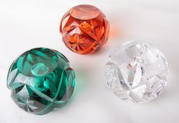 A group of three Whitefriars glass cut full lead crystal paperweights in flint, aqua and gold,