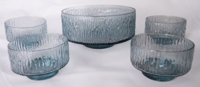 A Whitefriars glass textured Glacier fruit bowl set, in Arctic blue, designed by Geoffrey Baxter,