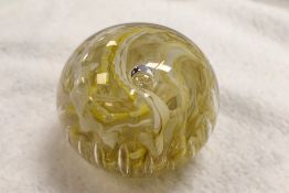 A Whitefriars glass full lead crystal 'streaky' paperweight, of un-cut dome form with central bubble