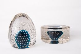 Two Whitefriars glass flint encased bubble over kingfisher blue core paperweights, catalogue numbers