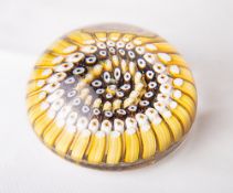 A 1940's/50's Whitefriars glass low-dome concentric millefiori paperweight, in yellows, white and