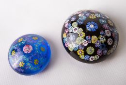 Two rare and unusual Whitefriars glass paperweight 'buttons' the larger of garland arrangement