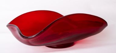 A large Whitefriars glass bowl in ruby red with folded rim, originally designed by James Hogan in