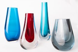 A group of four Whitefriars glass vases, comprising a cased blue oval tapering dimple vase, designed