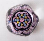A rare Whitefriars glass miniature garland paperweight, window-cut 5+1, having a central rose cane