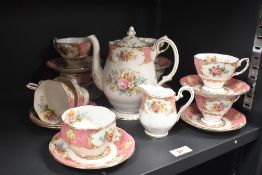 A Royal Albert 'Lady Carlyle' patterned coffee service, decorated with vignettes of flowers on a