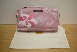 A Radley leather ladies handbag, in pink with stitched flower design, measuring 39cm long