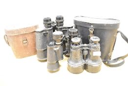 Three pairs of early-mid 20th Century binoculars and two cases, to include a pair by Dixey & Sons