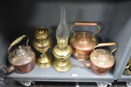 A selection of 19th Century brass and copper ware, to include three fireside kettles of graduating