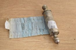 A Victorian white metal scroll, needle case, fitted with scroll, measuring 19cm long
